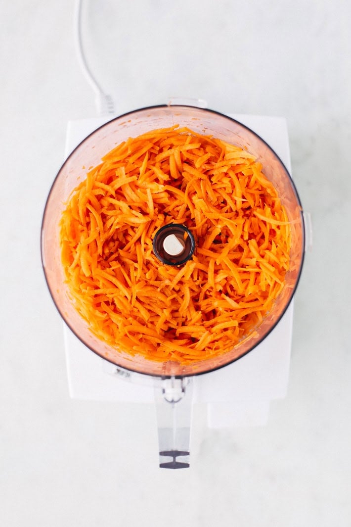 shredded carrots in a food processor