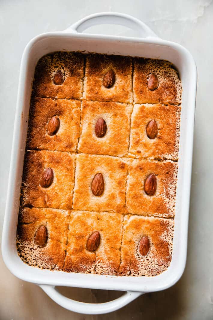 baked semolina cake in pan before soaking
