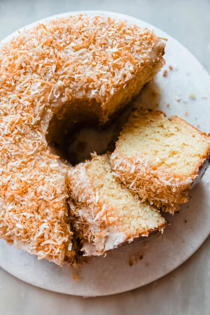 Louisiana crunch cake on marble with slices cut out