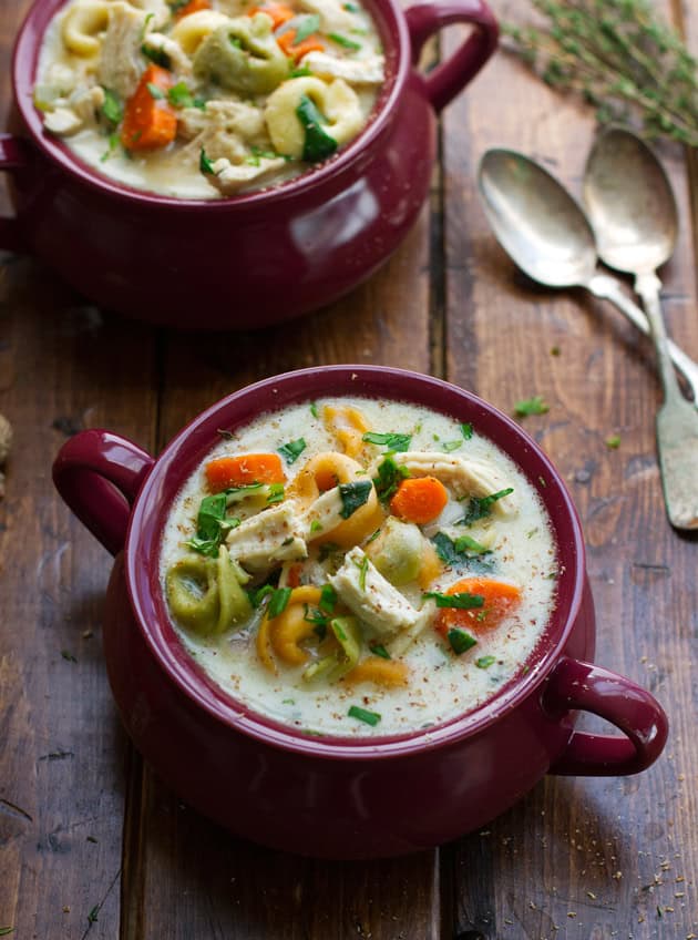tortellini chicken soup in crock on wood