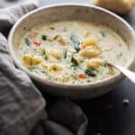 Creamy Chicken Tortellini Soup - a creamy chicken soup with tons of carrots, baby spinach, and cheesy tortellini. So perfect for fall! #chickennoodlesoup #chickensoup #chickentortellinisoup | Littlespicejar.com