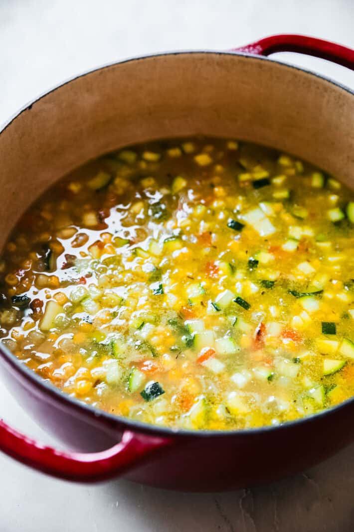 zucchini corn chowder simmering in pot