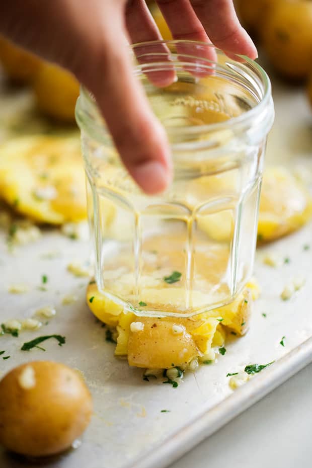 smashing potatoes with a glass