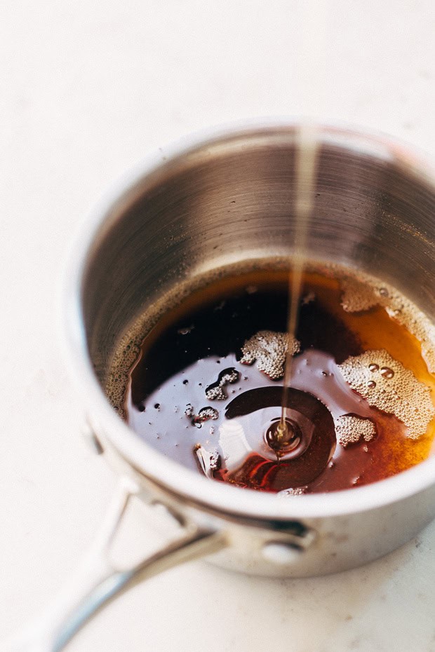 pouring honey into sauce pan