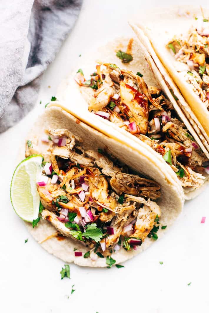 Pressure Cooker Crispy Chicken Carnitas - The easiest way to make carnitas! This instant pot recipe makes the most delicious carnitas! Top with lots of cilantro, onions, sautéed cabbage, and homemade chipotle sauce! #instantpot #carnitas #chickencarnitas #pressurecooker | Littlespicejar.com