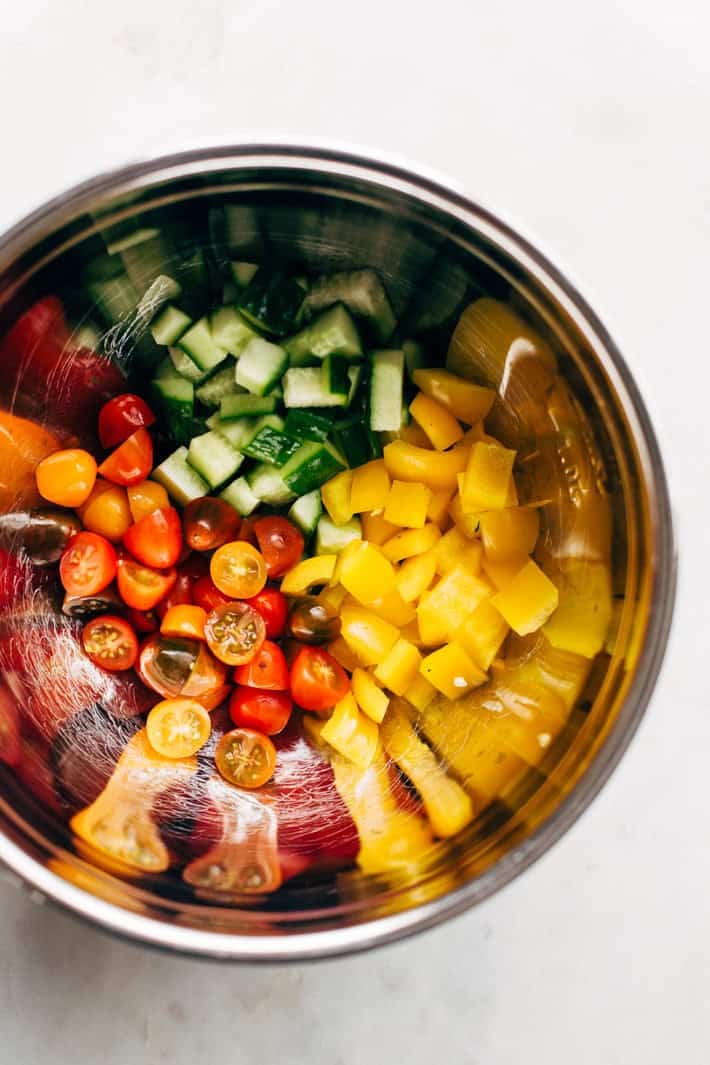 chopped peppers, cucumbers, and tomatoes in bowl