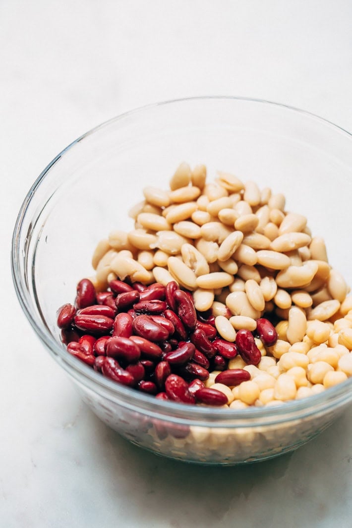 kidney beans, cannolini beans, and chickpeas in glass bowl