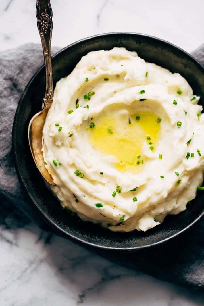 20 Minute Garlic Herb Instant Pot Mashed Potatoes - these mashed potatoes are loaded with flavor and require simple ingredients you've probably already got in your refrigerator. #instantpotmashedpotatoes #mashedpotatoes #instantpot #pressurecookermashedpotatoes | Littlespicejar.com