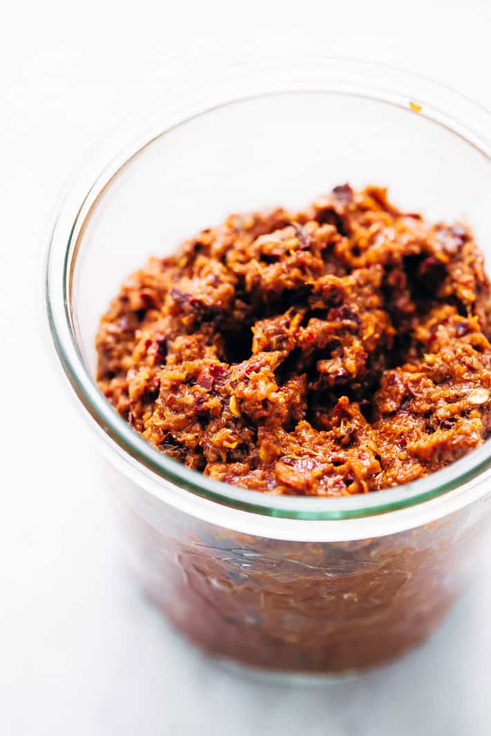 Homemade Thai Massaman Curry Paste - A quick 15 minute paste that's perfect to use in all kinds of curries! This can also be made vegan/vegetarian friendly. #massamancurry #homemadecurrypaste #thaicurry #massamancurrypaste | Littlespicejar.com massaman curry paste in jar
