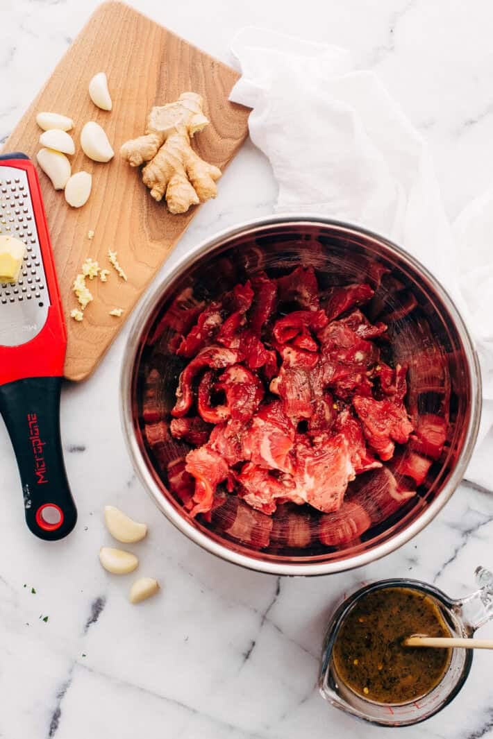 ingredients to marinate meat with on white marble