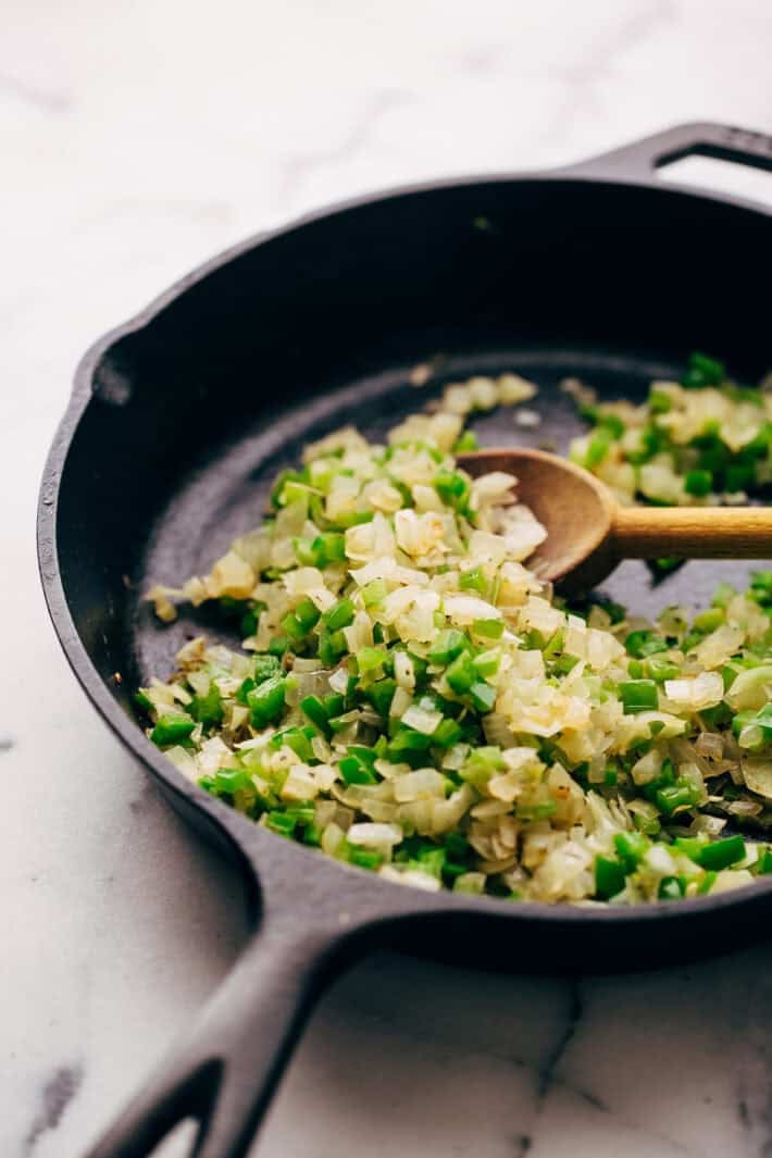 sautéed onions and peppers in cast iron skillet