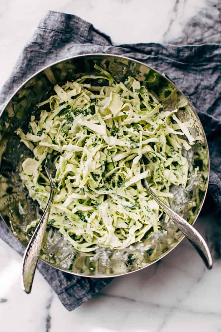 jalapeno lime slaw in bowl with two forks