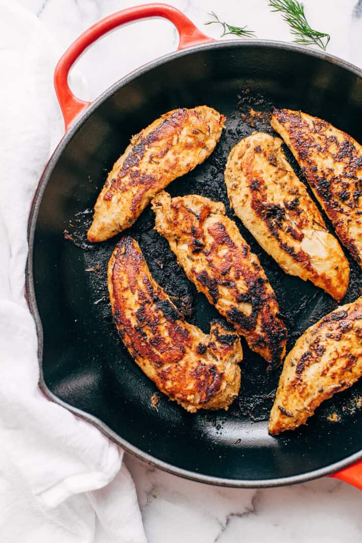 chicken gyro tenders in cast iron pan