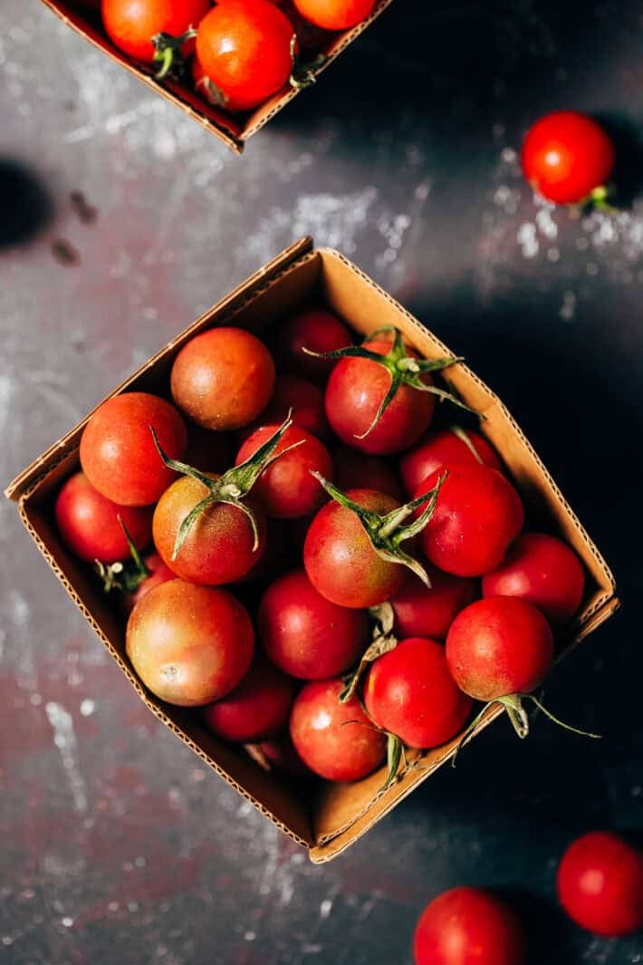 fresh cherry tomatoes in cardboard container