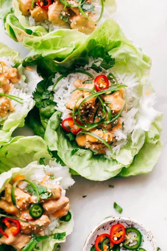 Bang Bang Chicken Lettuce Wraps - a homemade lettuce wrap stuffed with jasmine rice, sautéed chicken and tons of bang bang sauce! #bangbangchicken #bangbangsauce #bangbanglettucewraps #chickenlettucewraps | Littlespicejar.com