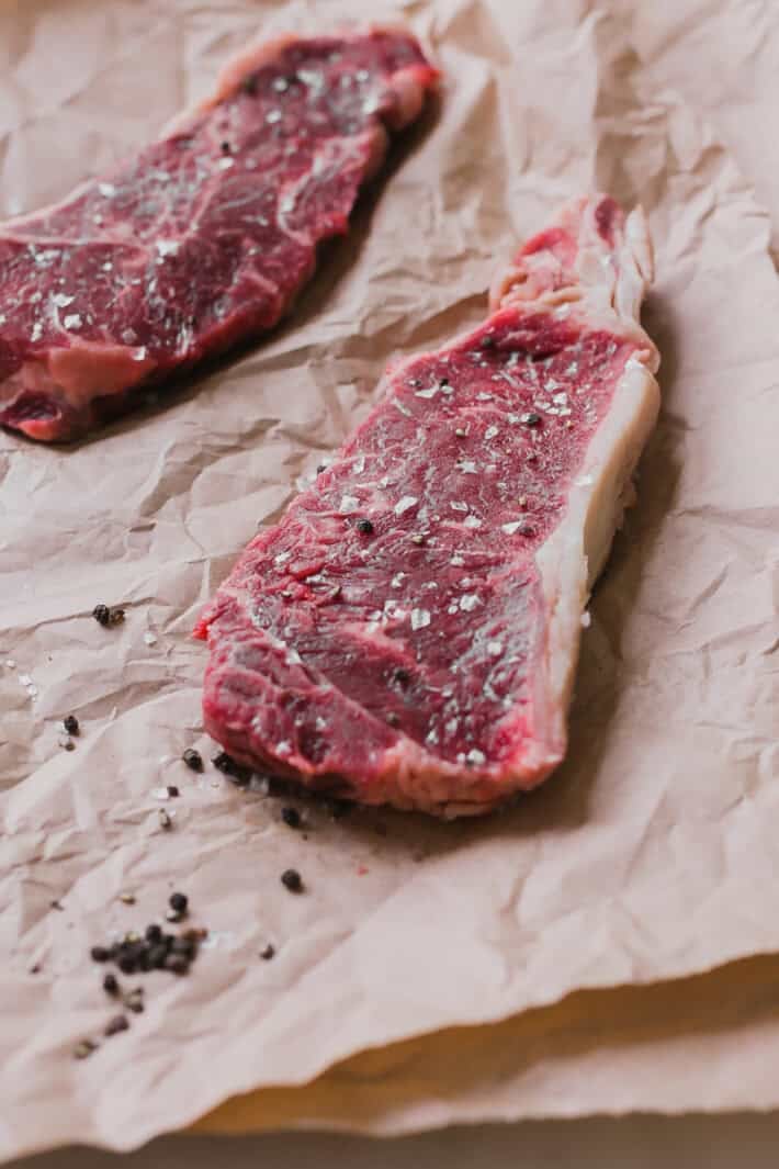 precooked steak on butcher paper