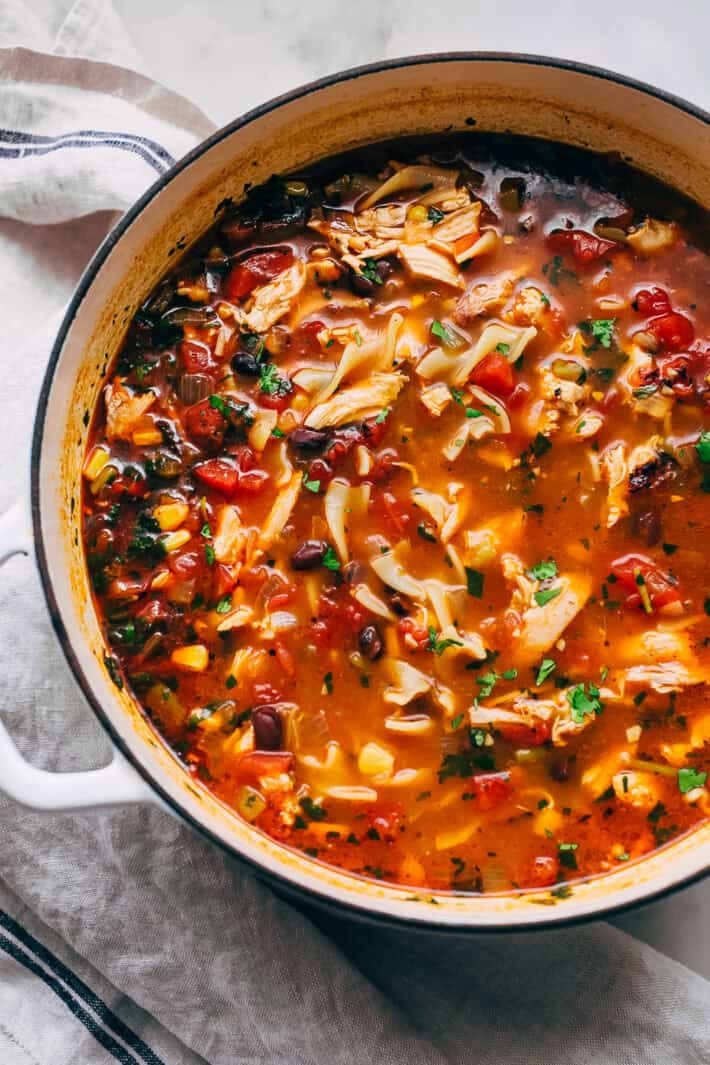 cast iron pot filled with prepared Mexican chicken noodle soup
