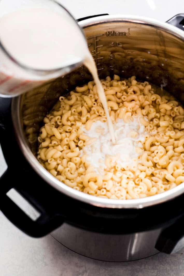 during milk into cooked macaroni in instant pot
