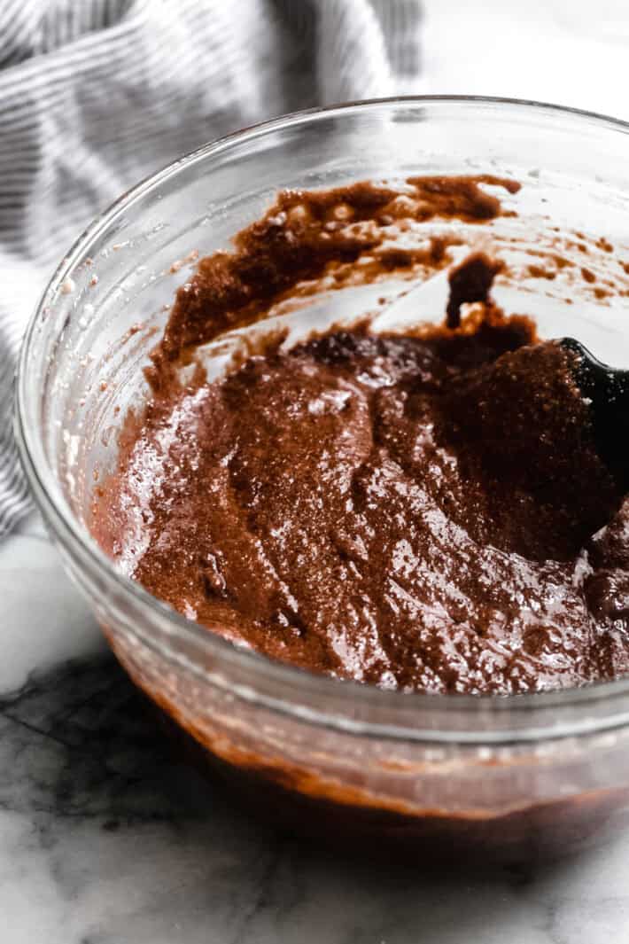 Caprese cake mixture whipped in a glass bowl