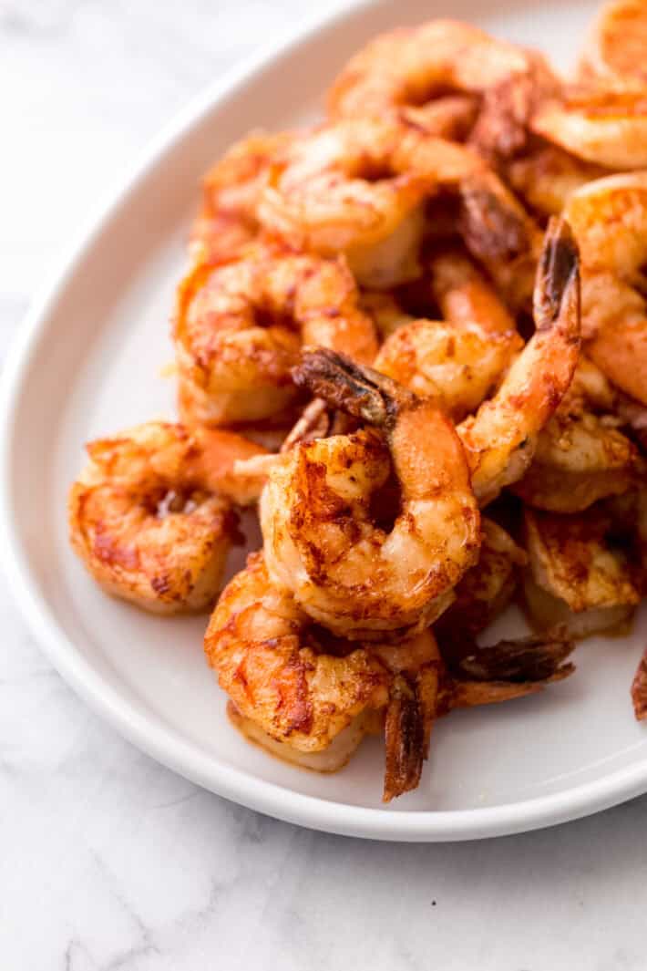 cooked Hawaiian shrimp on a white plate