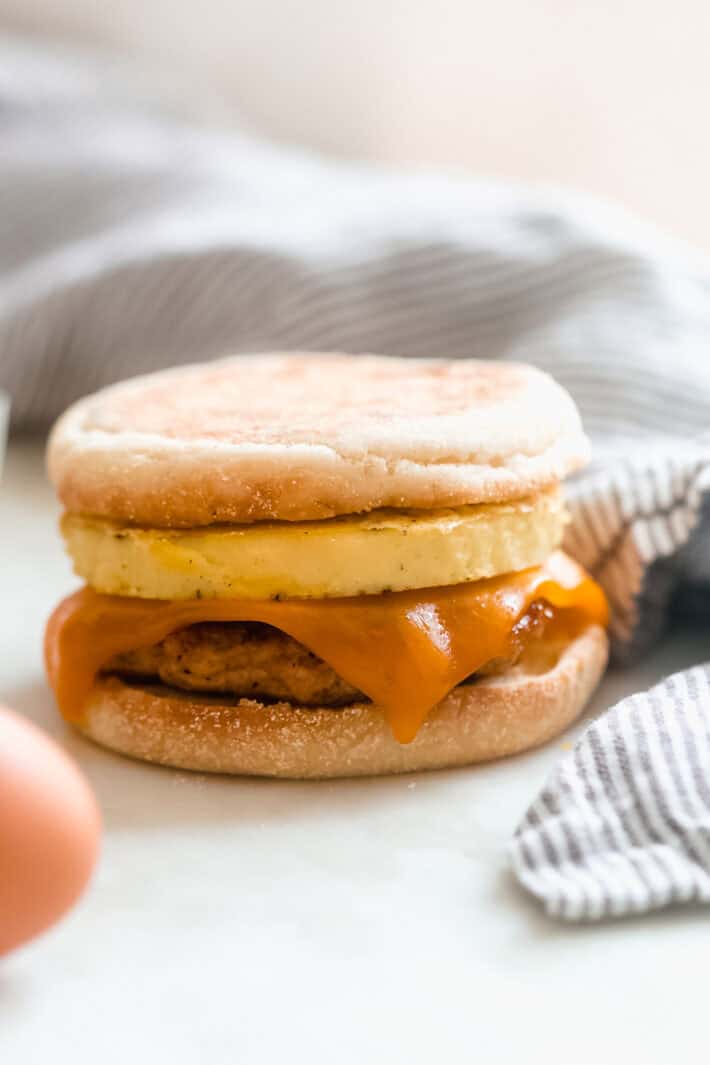 freezer breakfast sandwich on white marble with napkin