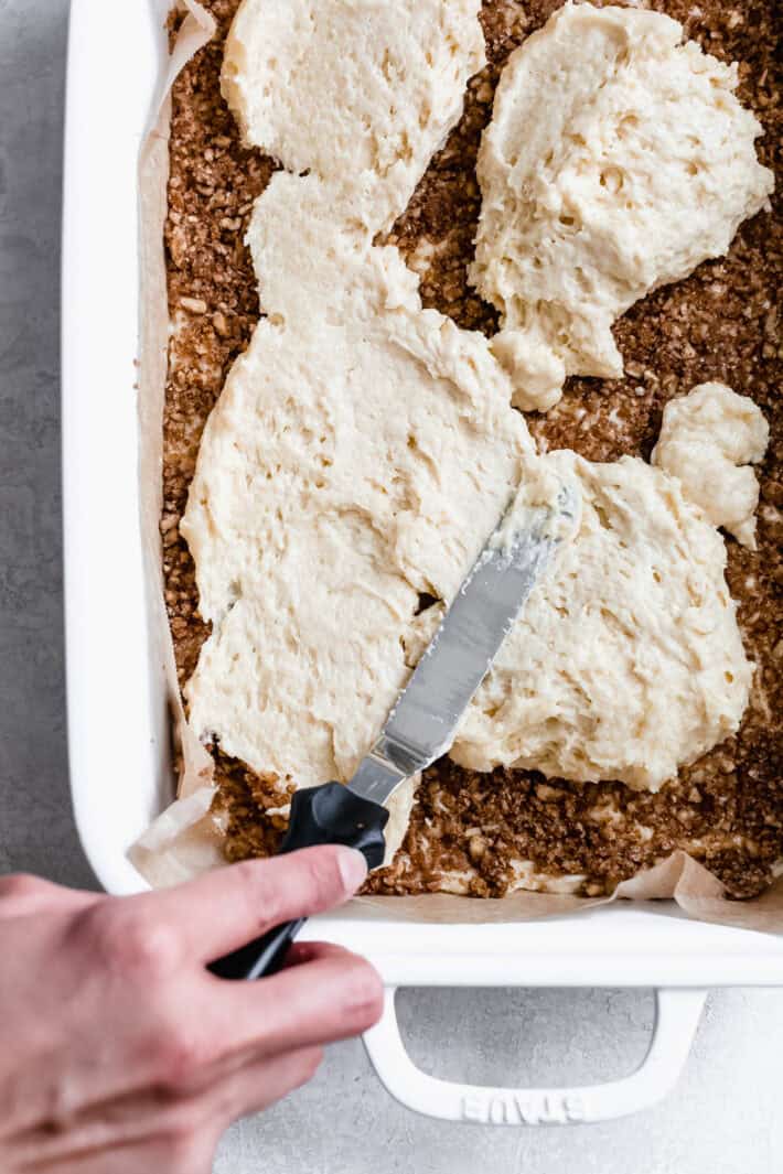 spreading the batter over the pecan layer of coffee cake