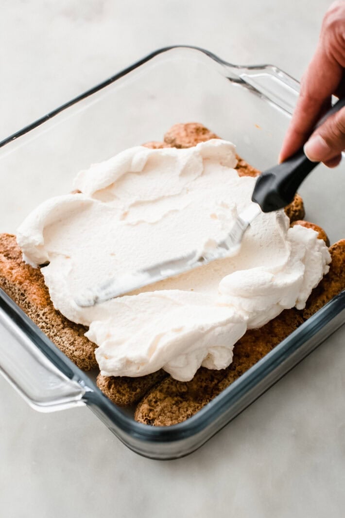 spreading mascarpone over espresso dipped lady fingers