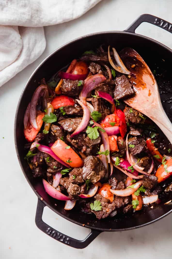 wooden spoon full of stir fry