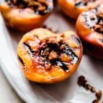 grilled peaches topped with cookie crumble