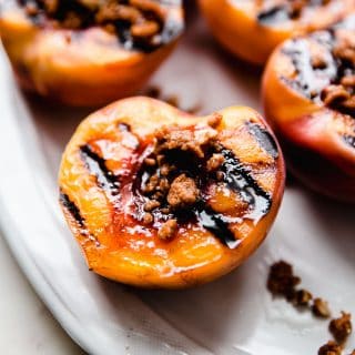 grilled peaches topped with cookie crumble