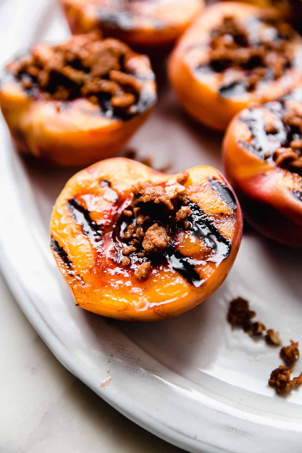 Grilled Peaches with Cookie Crumble and Vanilla Ice Cream