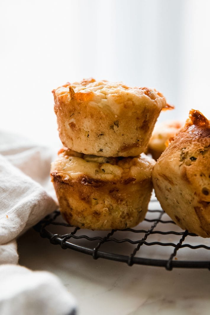 baked muffins stacked on wire rack