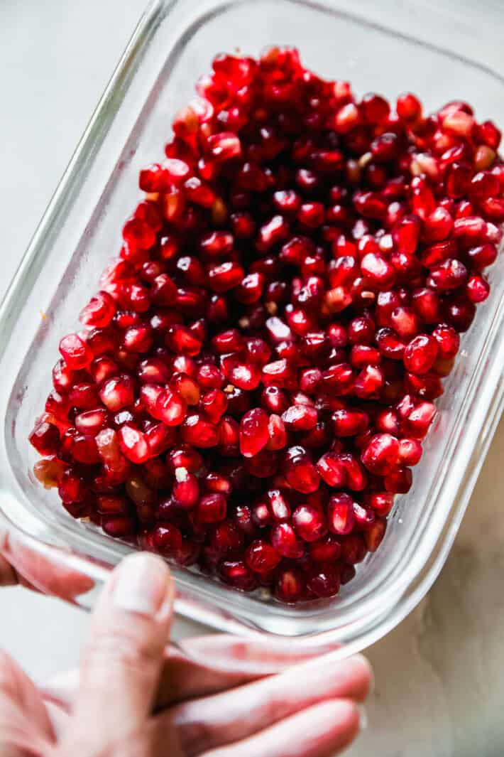 pomegranate arils in a glass container