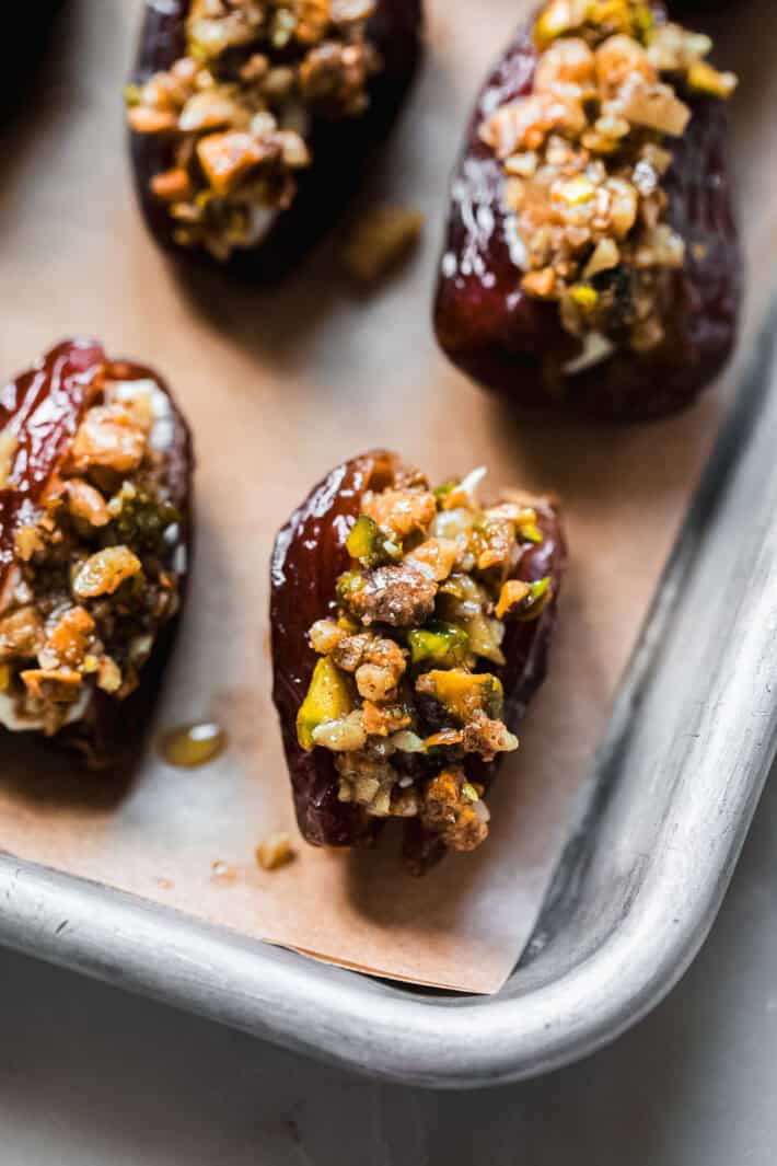 dates with nut filling on metal baking sheet
