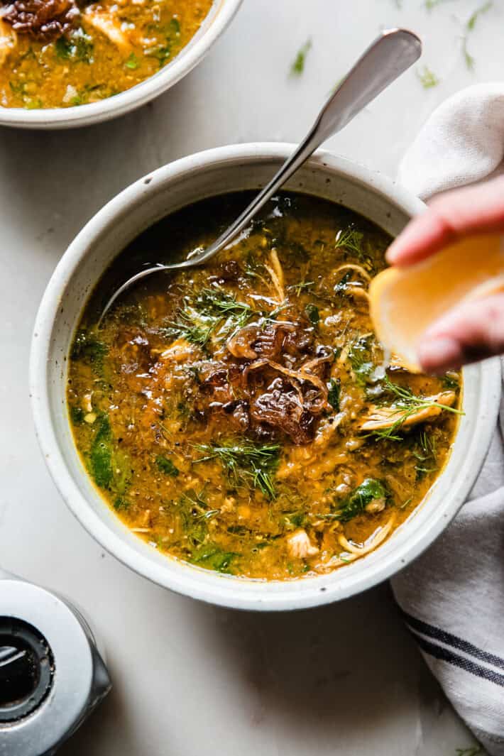 chicken lentil soup topped with caramelized onions and drizzled with lemon juice