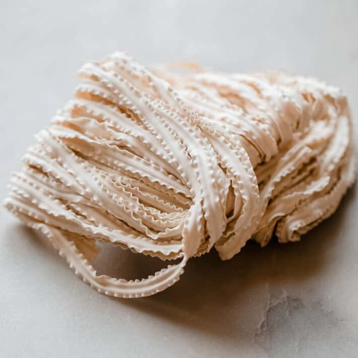 knife cut noodles on marble