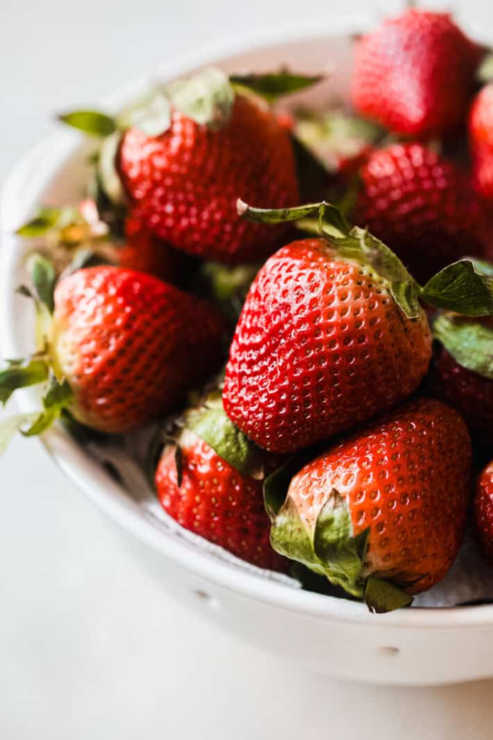 wash and dried strawberries in white colander