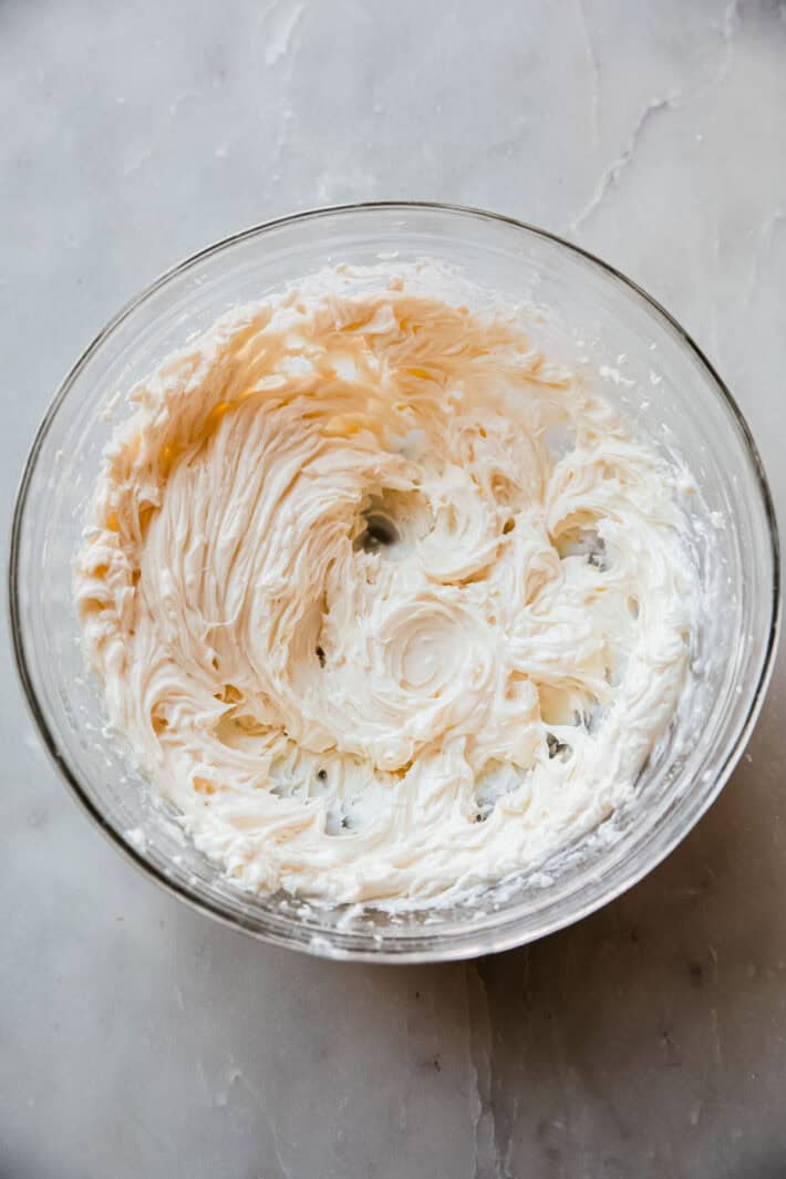whipped cream cheese filling for strawberries in glass bowl