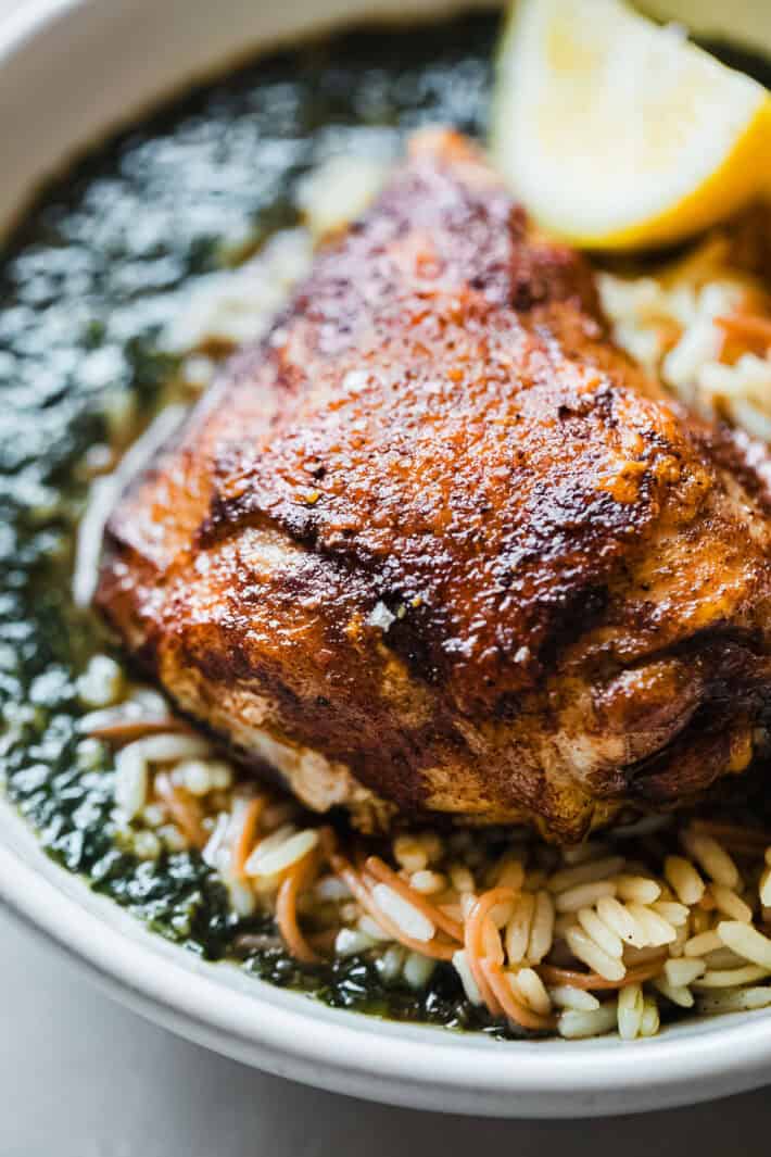 roasted chicken thigh over molokhia with vermicelli rice