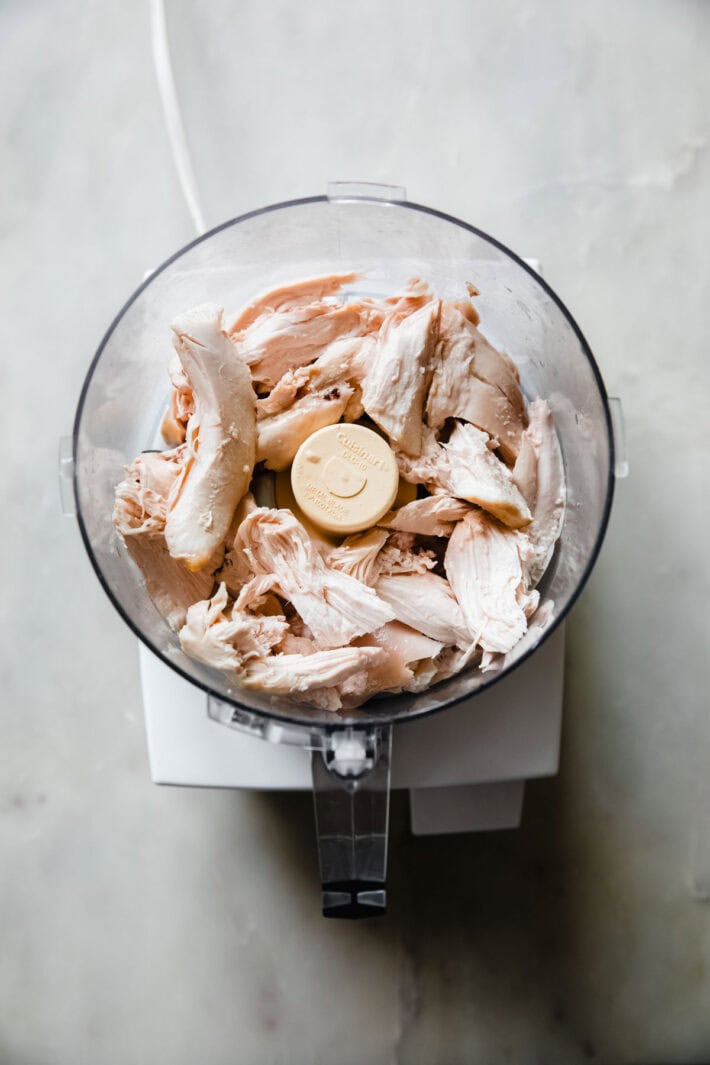 roasted chicken in food processor before pulsing