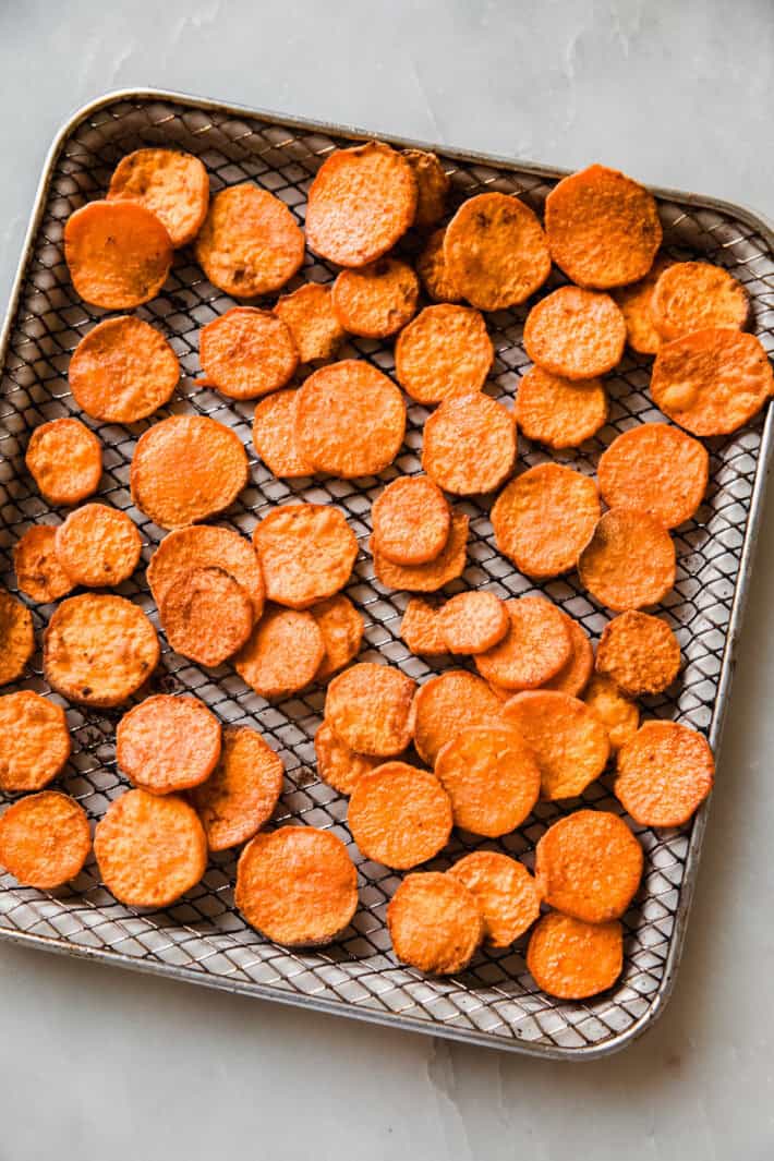 sliced sweet potatoes on wire rack after air frying