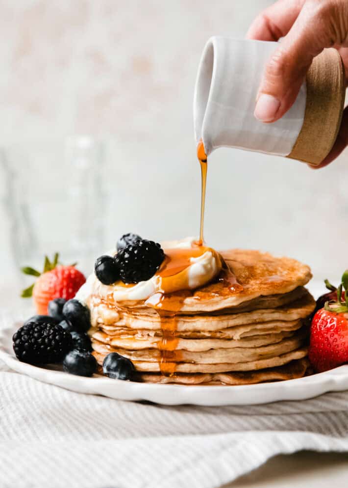 syrup pouring over cottage cheese pancakes