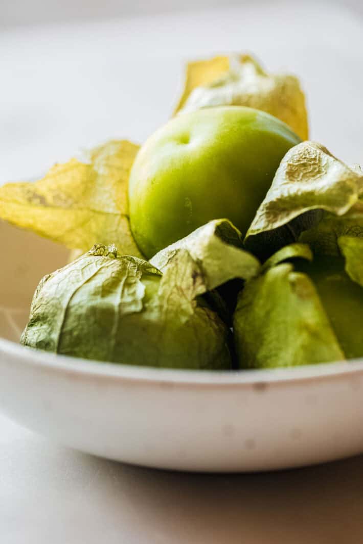 tomatillo with papery husk coming off