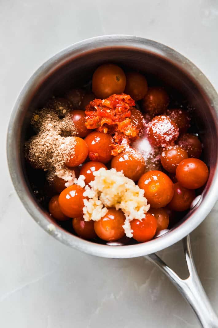 ingredients for tomato confit in sauce pan