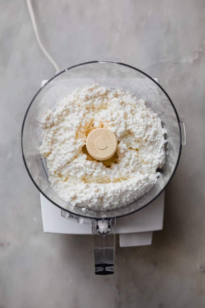 cottage cheese in food processor bowl before blending