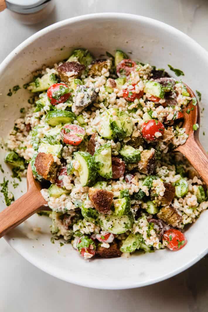 falafel salad in bowl topped with lemon tahini dressing