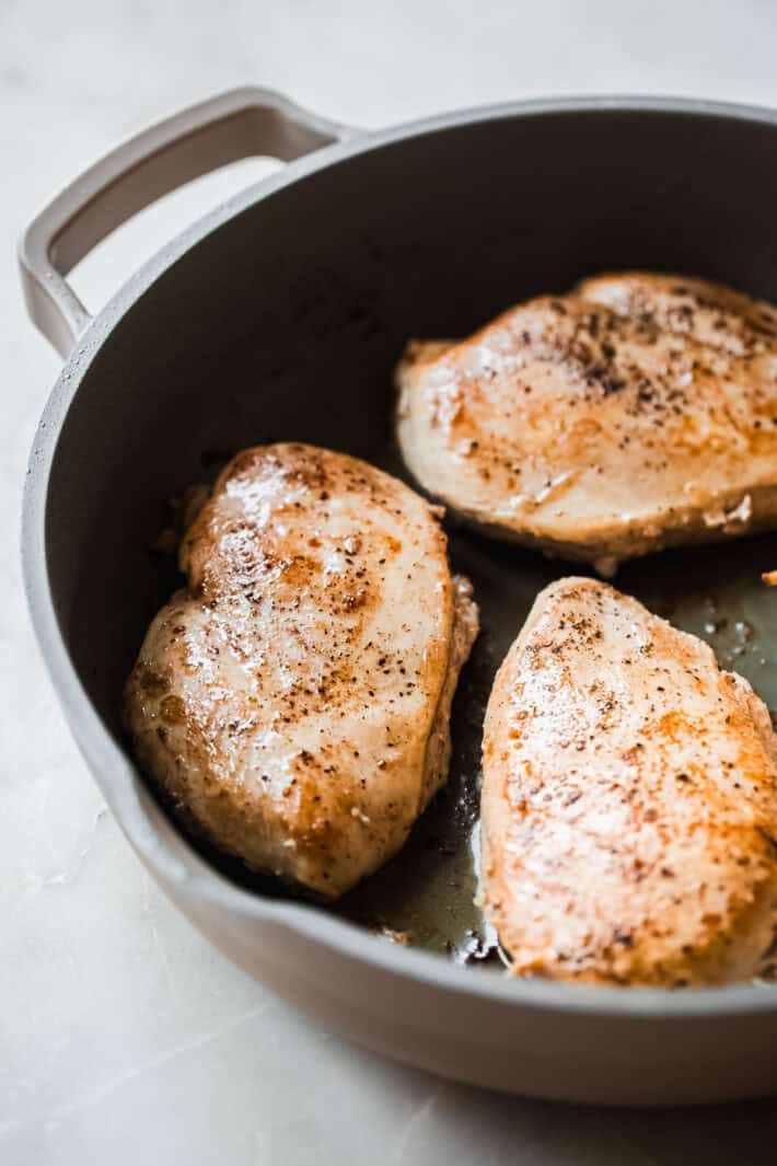 seared chicken breasts in skillet