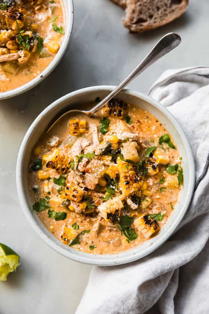 chicken and corn chowder with poblano in bowl topped with cilantro